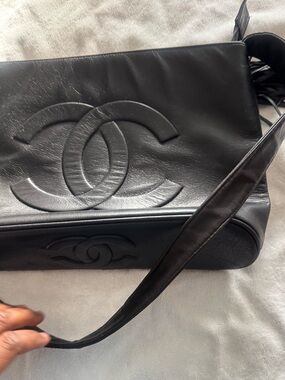 CHANEL Black Leather Messenger Bag with Embossed CC